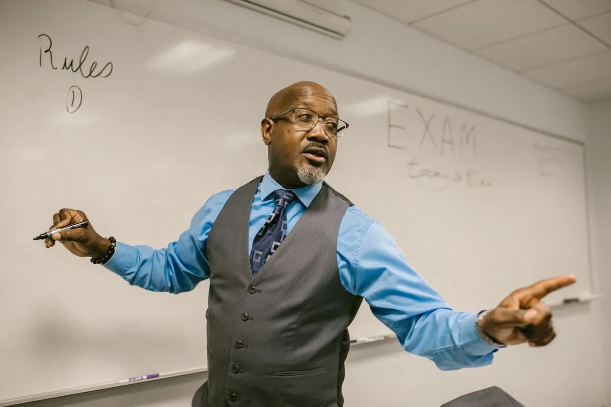 A teacher explaining a lesson at the whiteboard